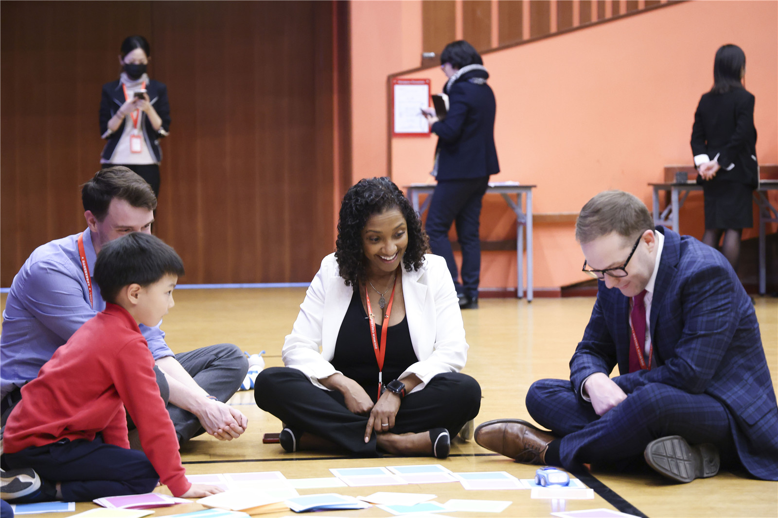 Junior School student learning with head of school and teachers