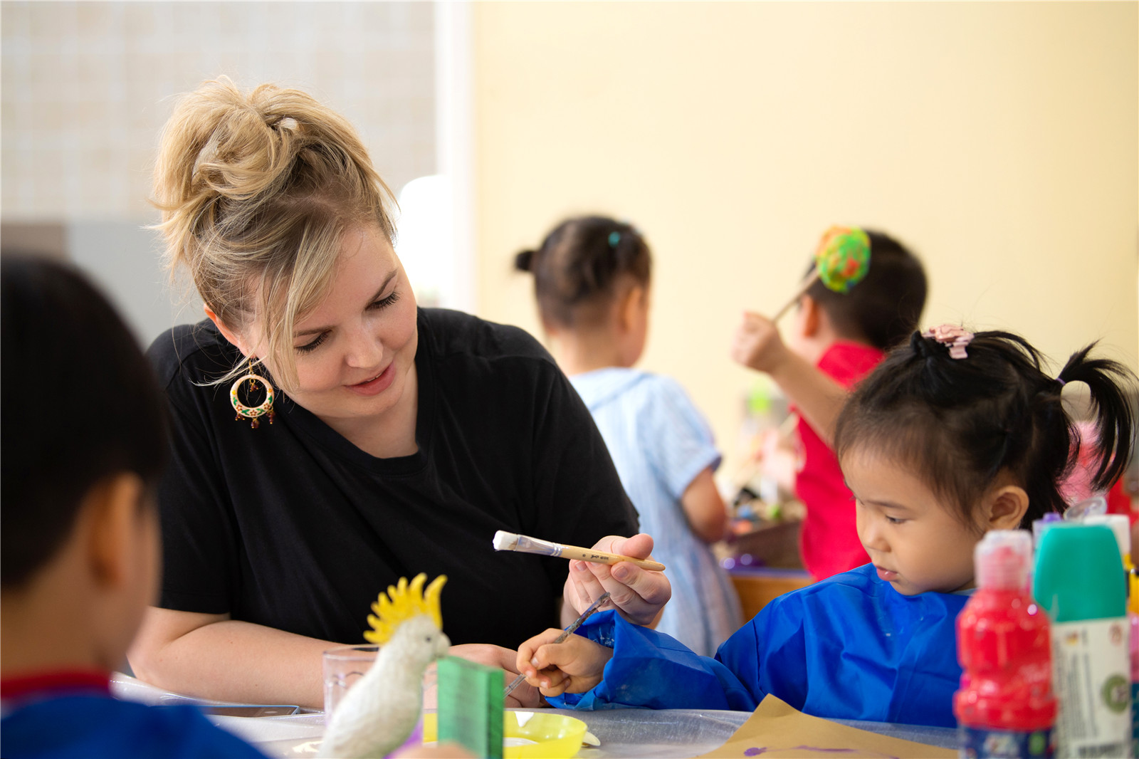 Teacher and students playing and learning