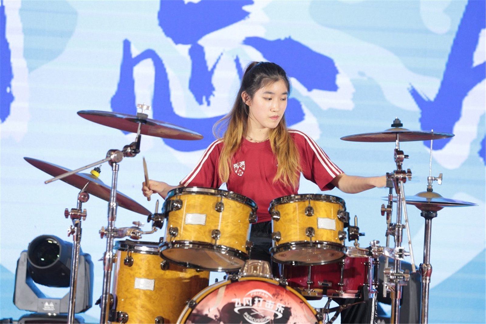 Ellie competing in a drums competition