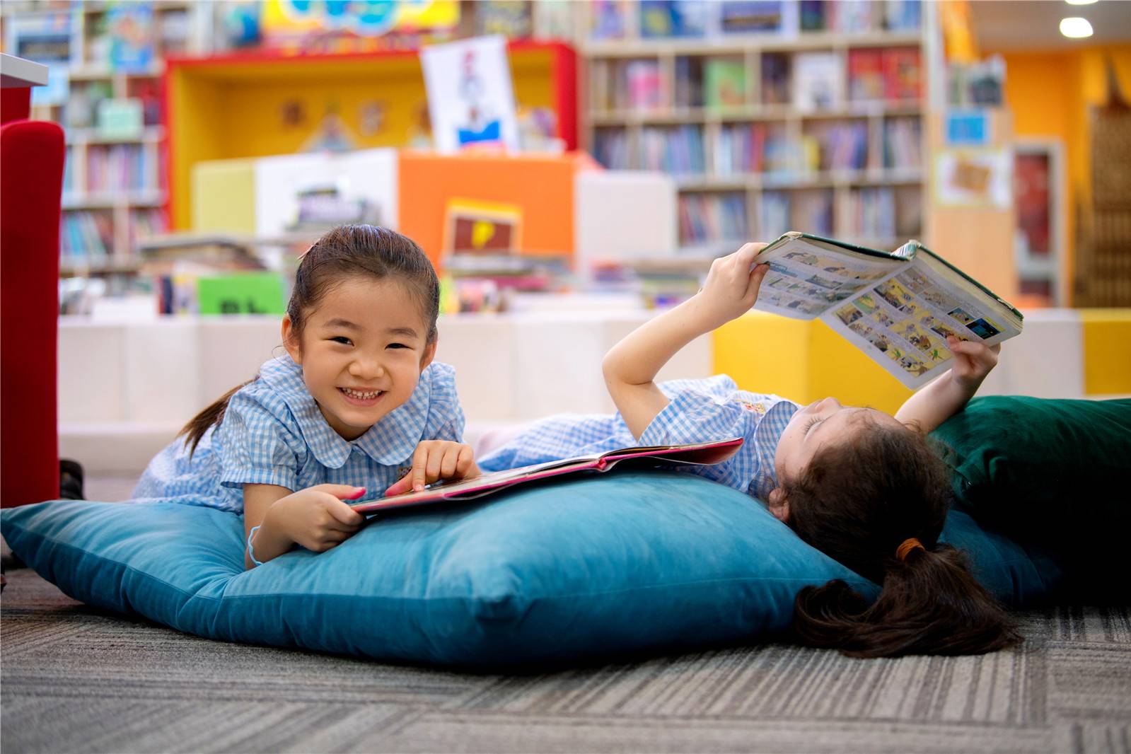 Young students reading in the library