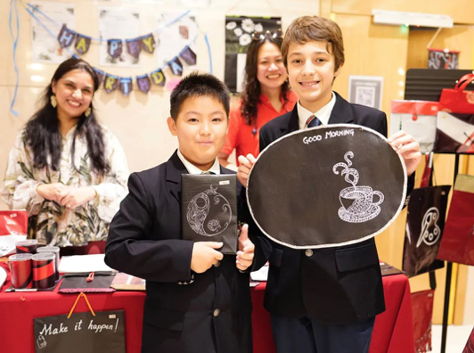 Students showcase recycled crafts to OWYE attendants