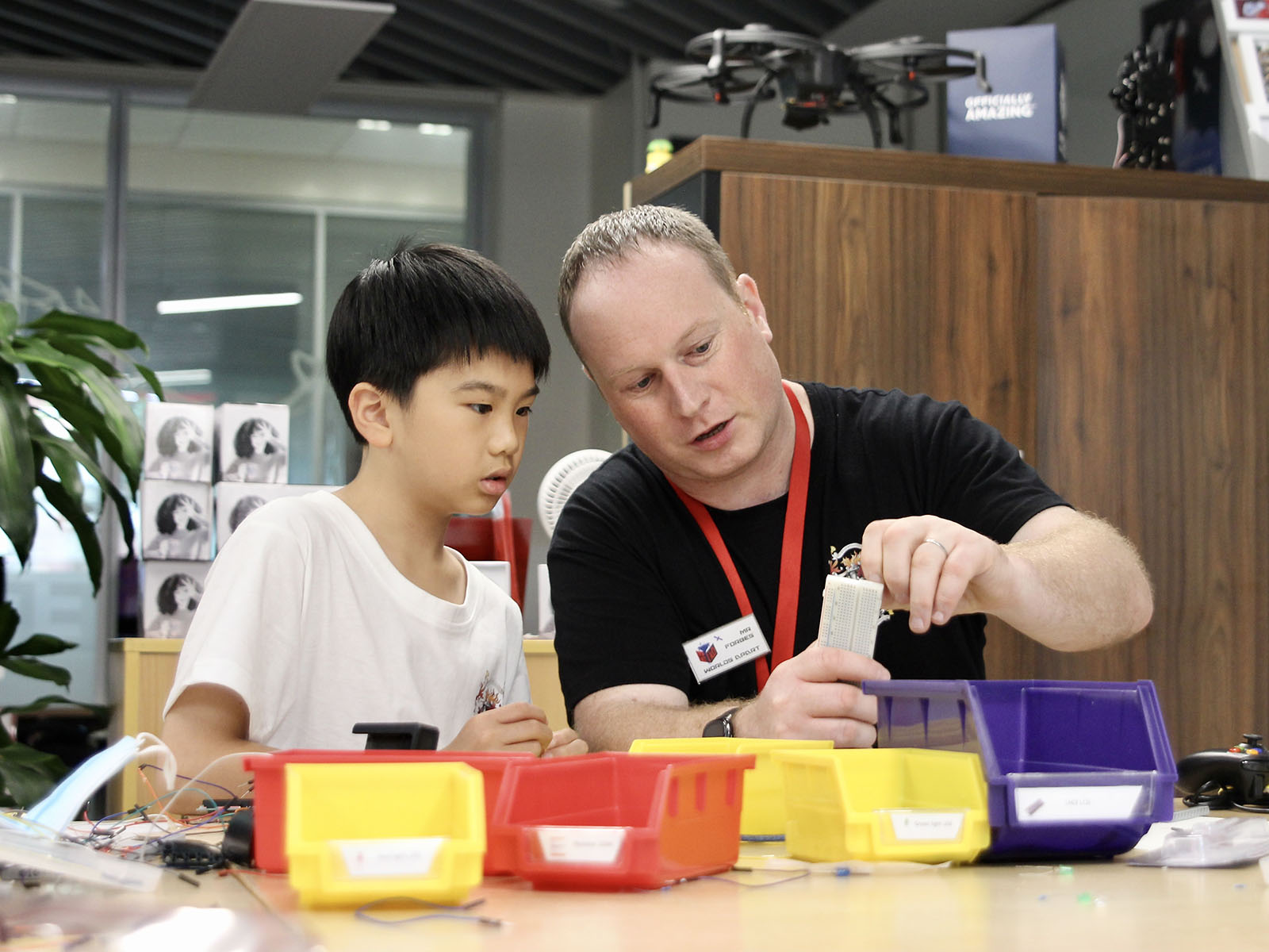 Head of Computer Science Paul Forbes works with student in a HakD workshop