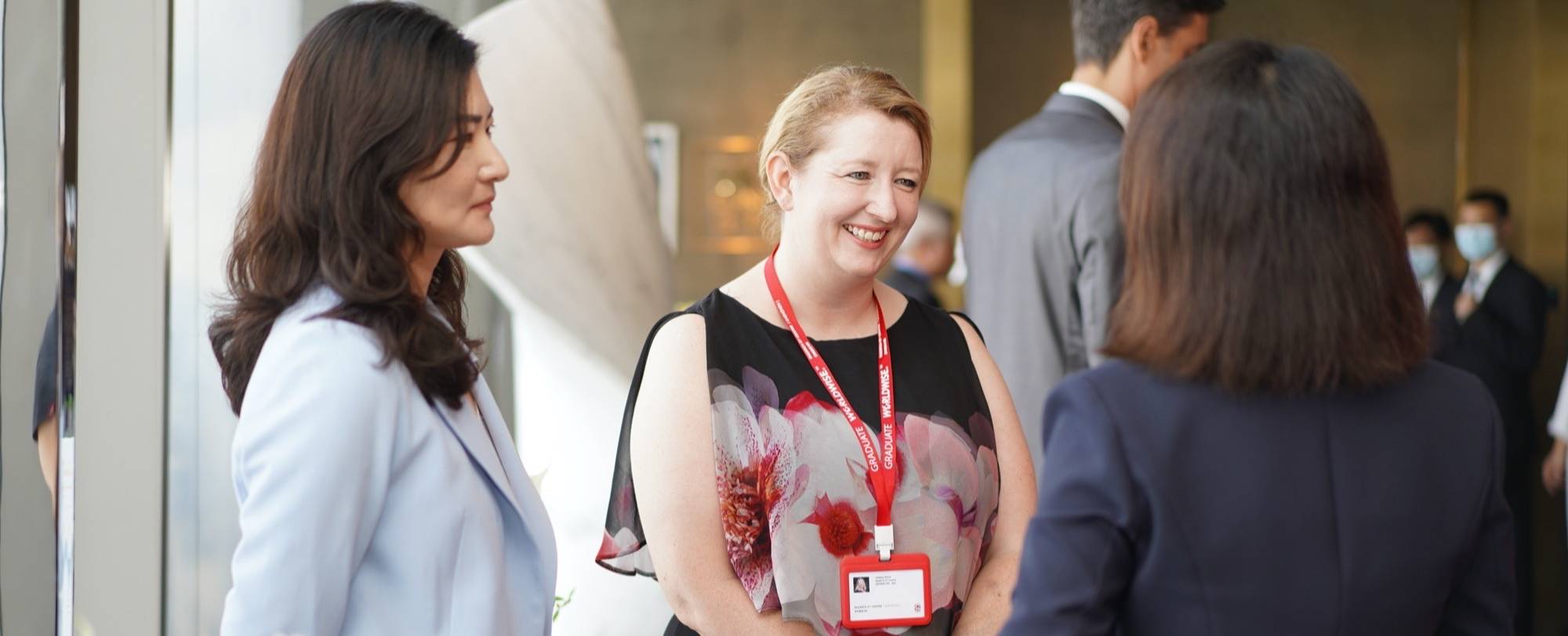 head-of-ey-lindsey-welch-and-head-of-amc-tramy-zheng-speak-with-guests