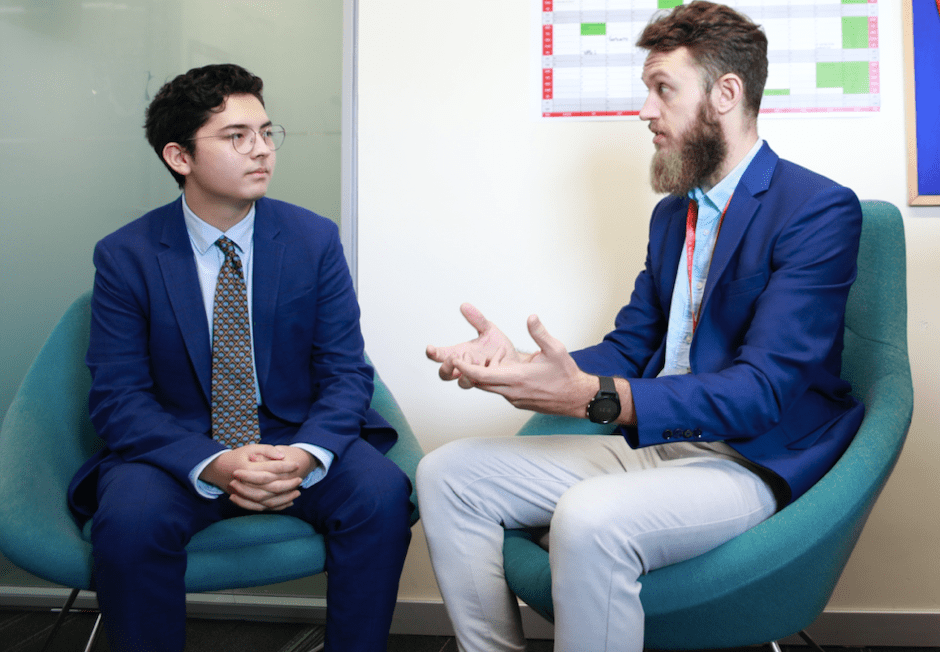 Mr. Devlin counsels a Senior School student