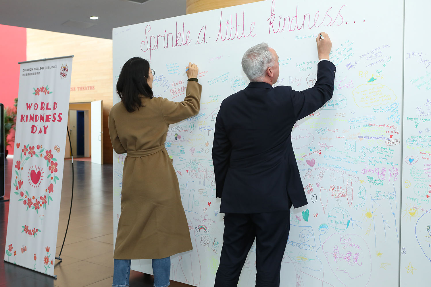 Andrew McCully Visits DCB - Signing on Kindness Wall
