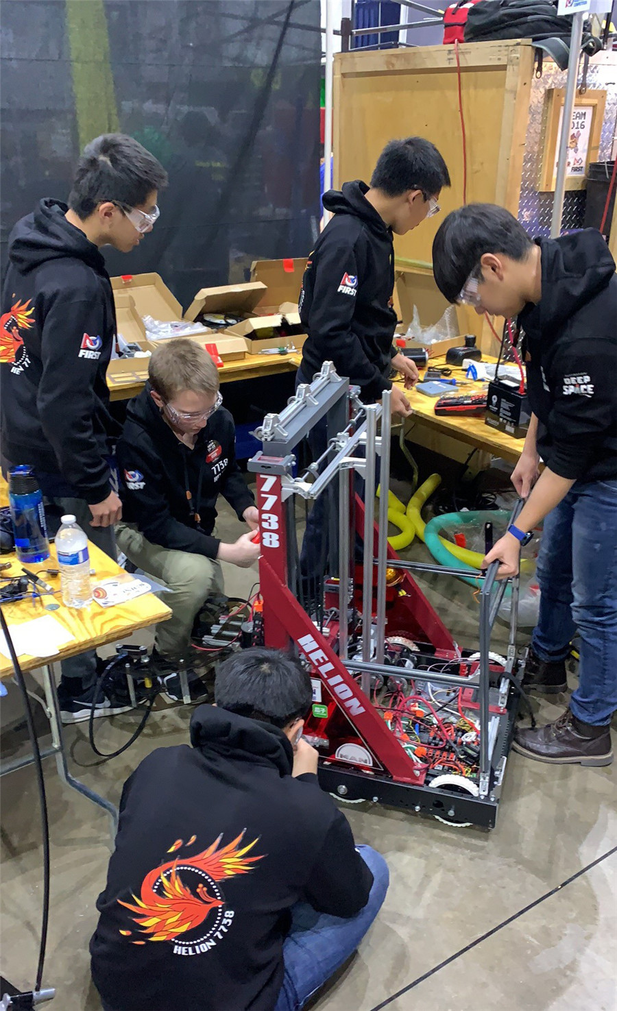 Dulwich College Beijing Team Helion working at FIRST Robotics Competition Midwest Regionals Chicago