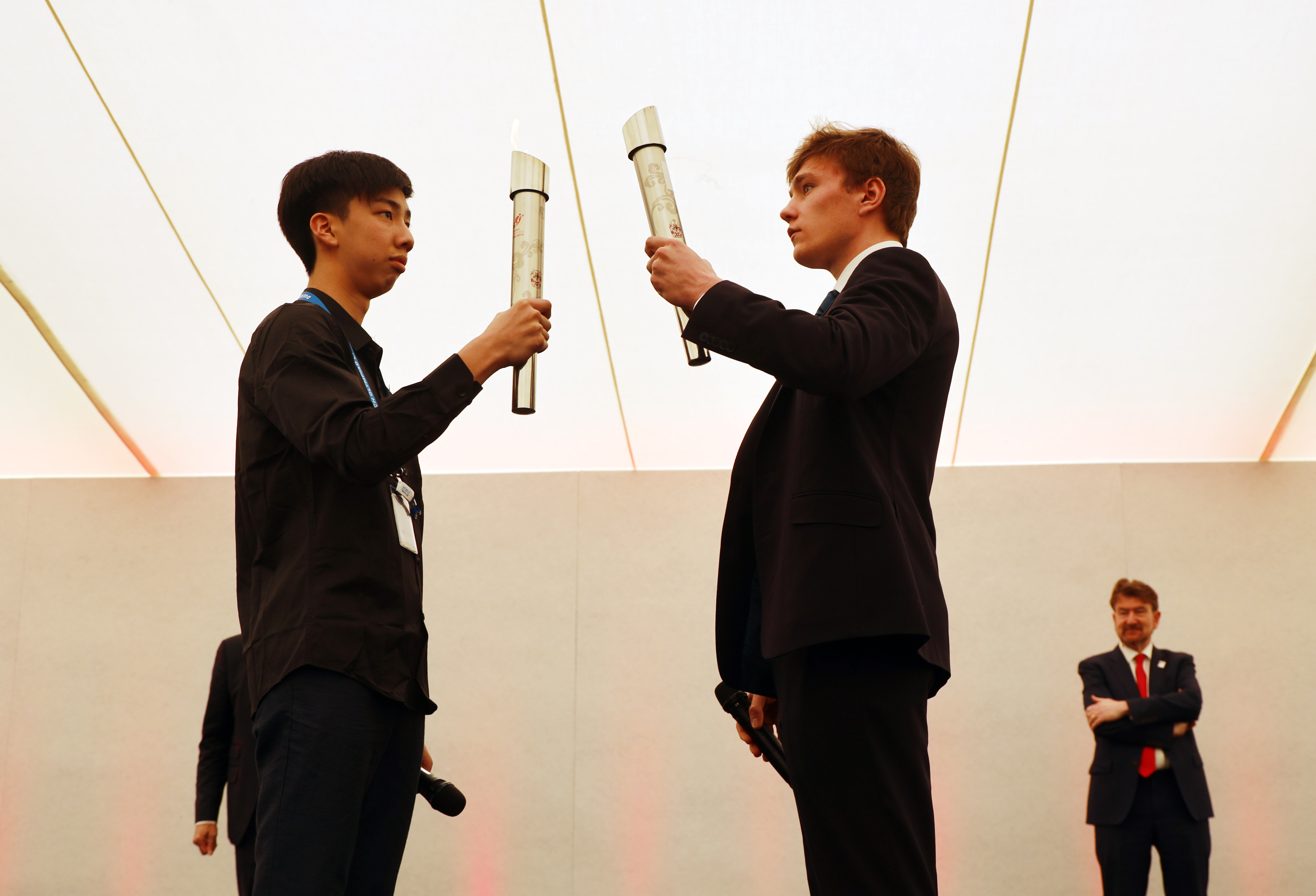 Passing of the torch from Beijing to London at Dulwich Olympiad 2019