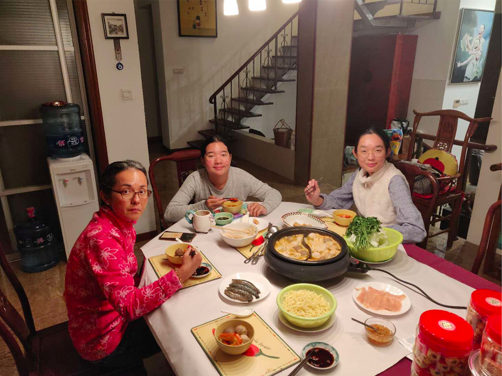 Gloria enjoys a meal with her two daughters during the online learning period