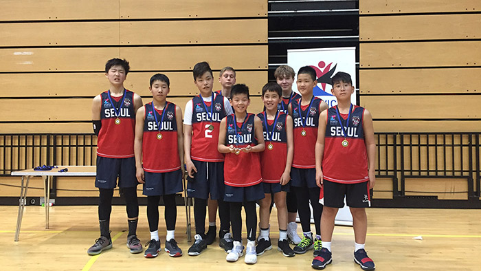 Dulwich College Students playing in the Olympiad Basketball tournament at the Copper Box Arena within Queen Elizabeth Park.