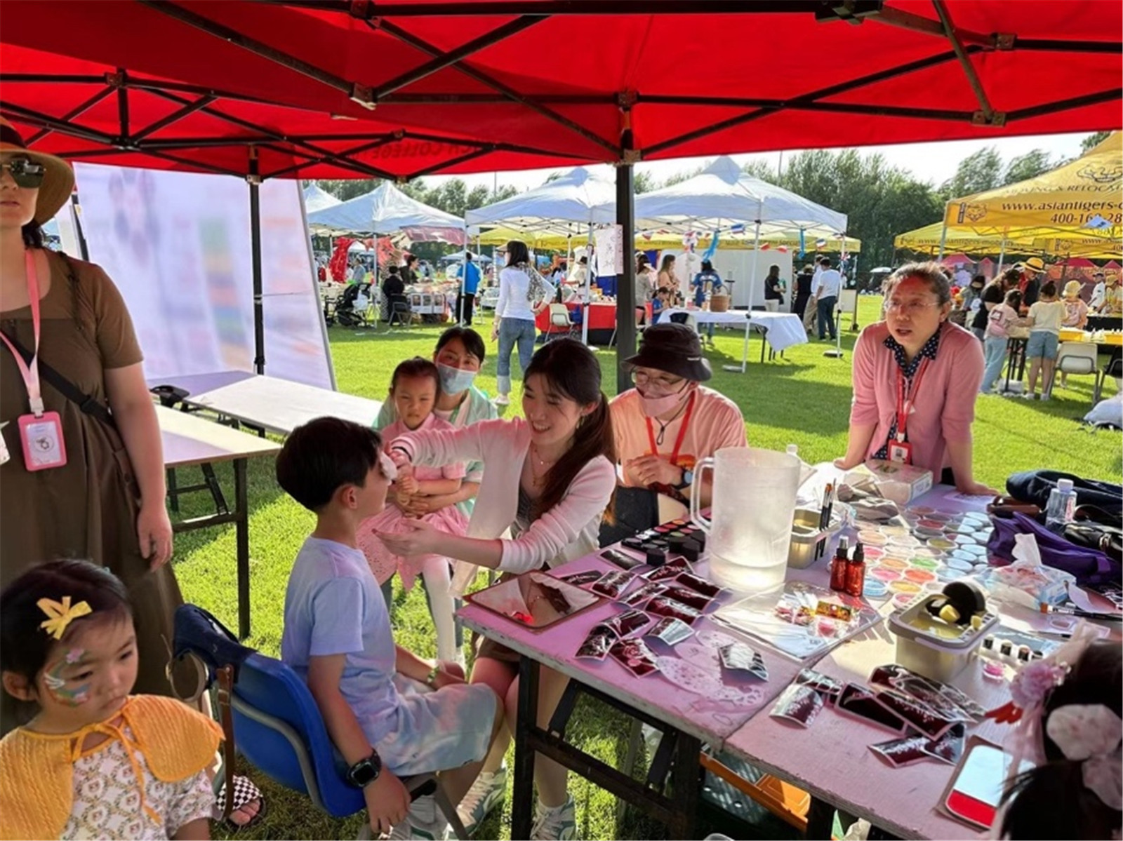 Ellie helping out at the art stall during Founders Day