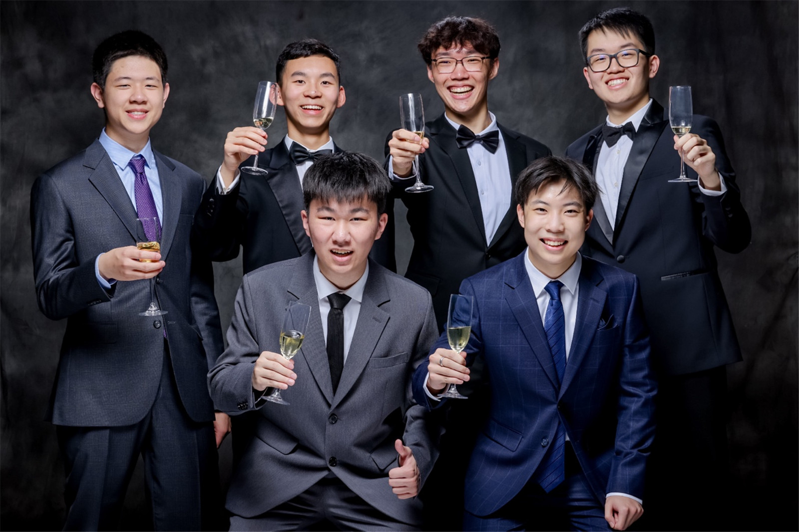 Brian and his classmates from the Class of 2024 take a group photo at Graduation Dinner