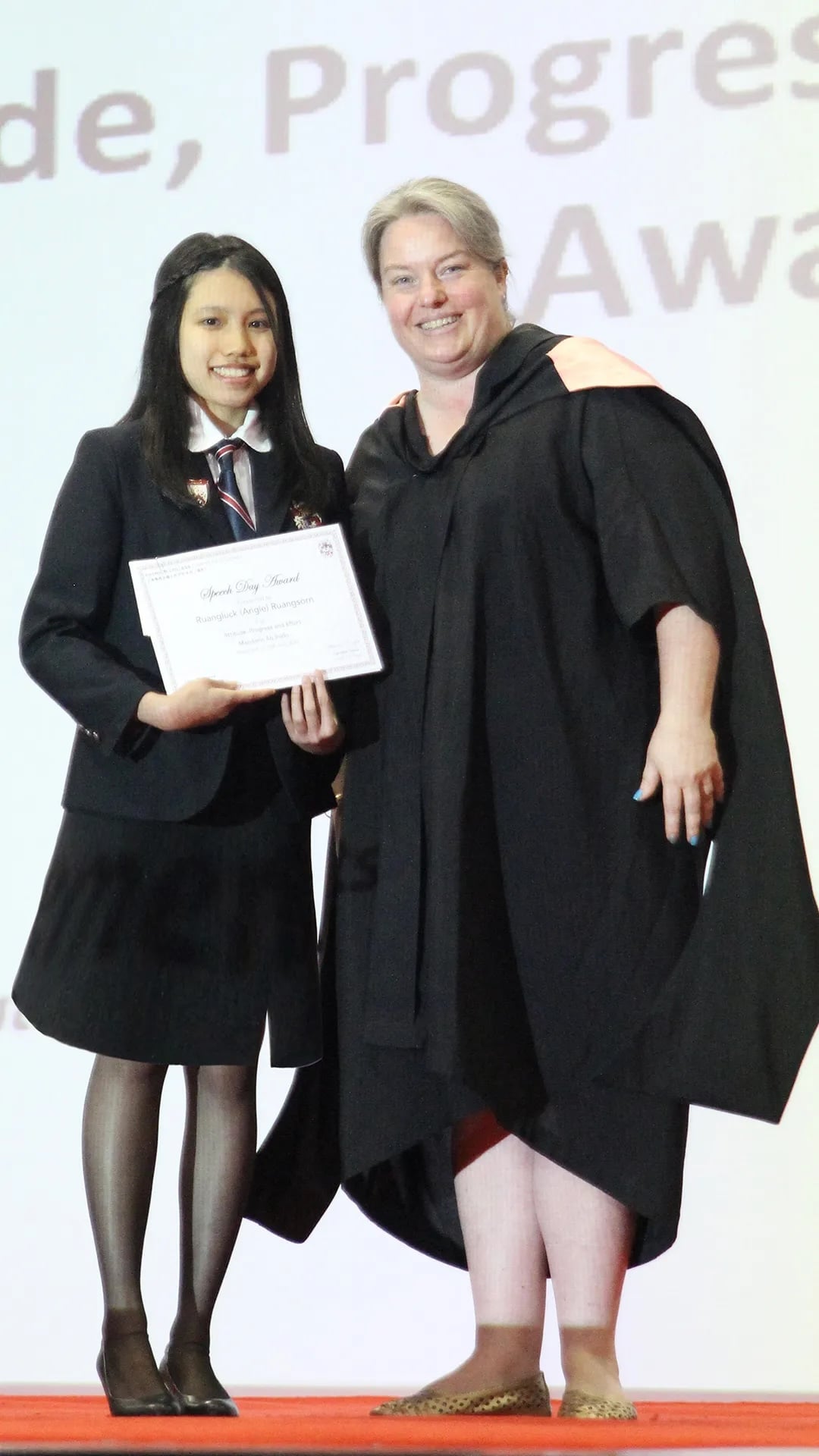 Angie receives an award from previous Head of Senior School, Alison Derbyshire