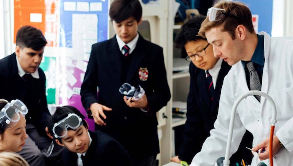 Teacher and students in science class