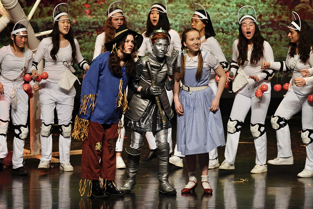 Scarecrow, Tinman and Dorothy in the orchard