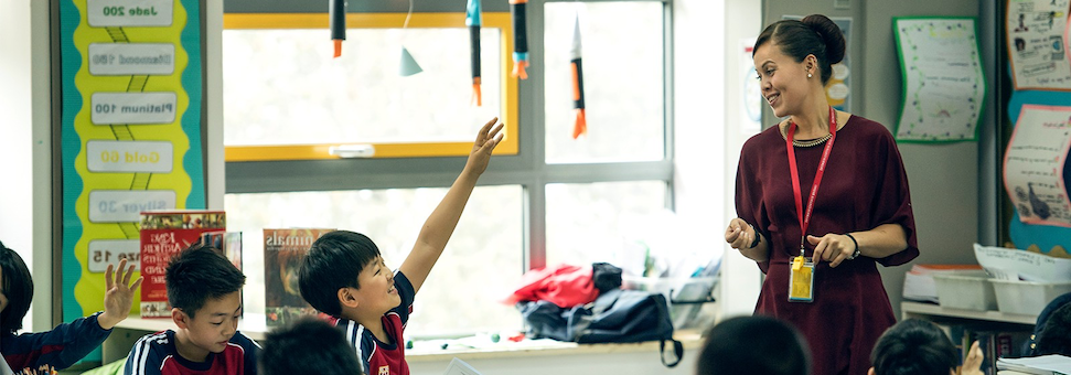 Teacher Engaging with School Children in a Lesson