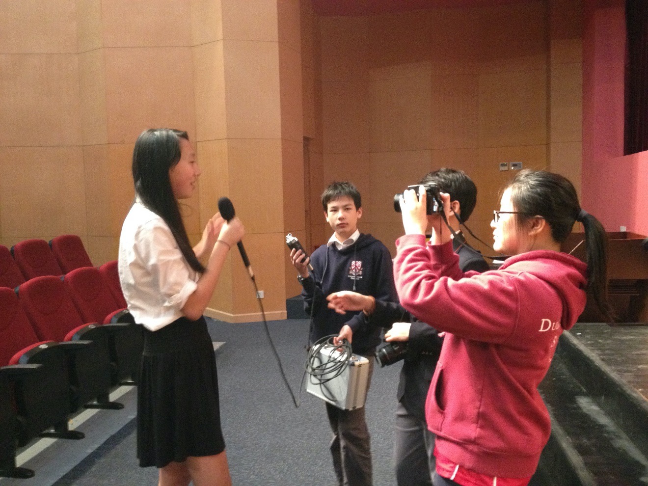 Amy at Dulwich being interviewed by student reports for her involvement in the Project Muse Charity