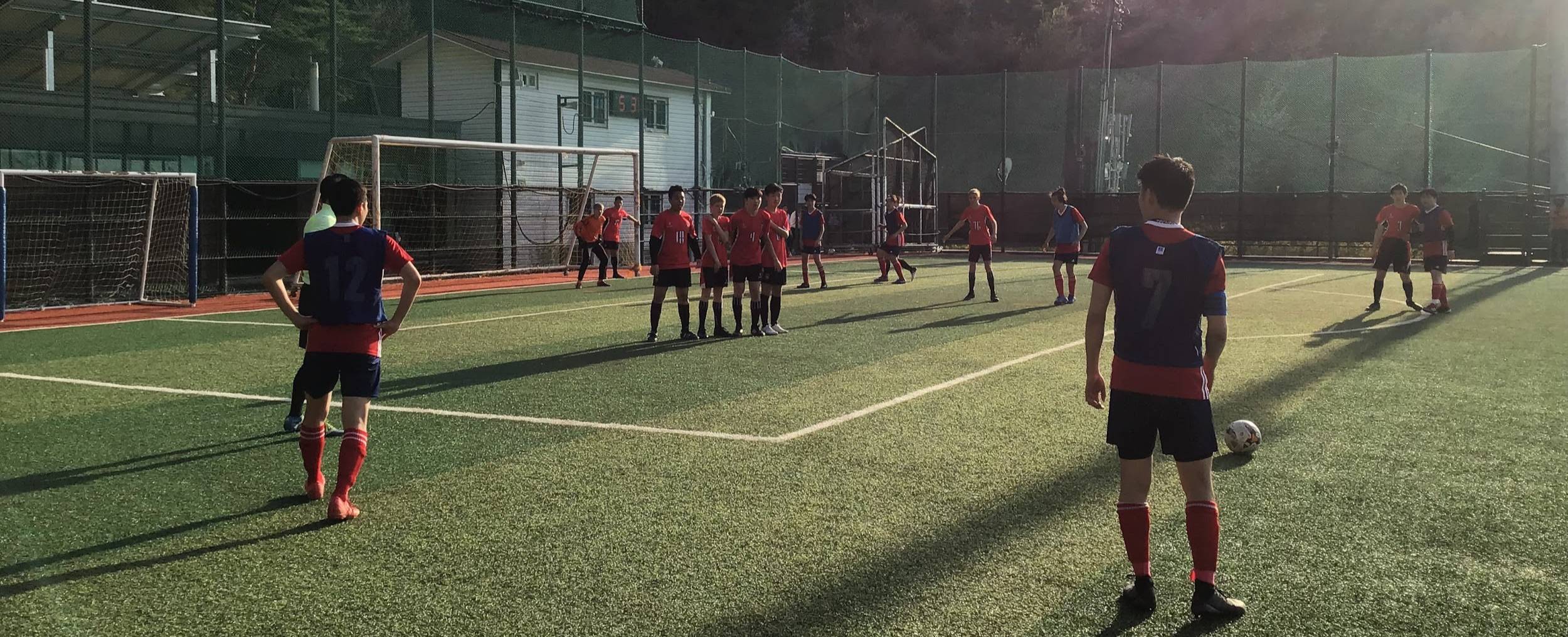 Dulwich College Seoul U18 Football Team on the field during the match