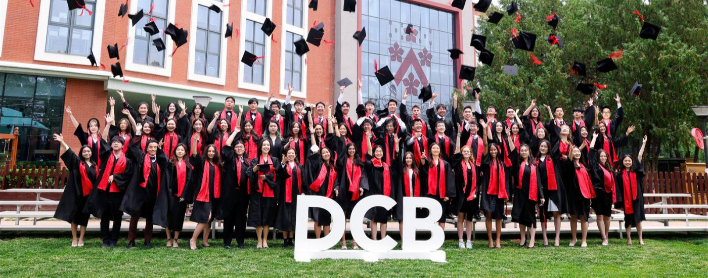 Class of 2022 graduation group photo - cap throwing