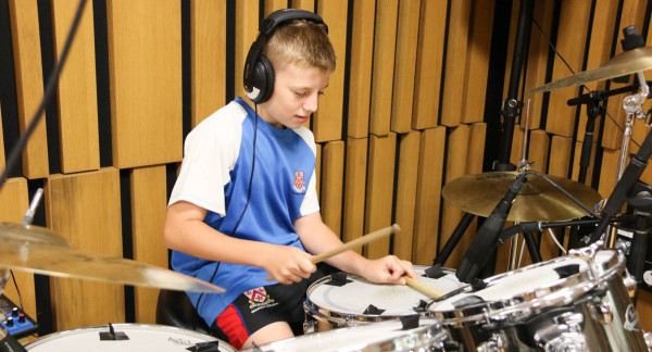Dulwich College (Singapore) student creating music with Roo Pigott