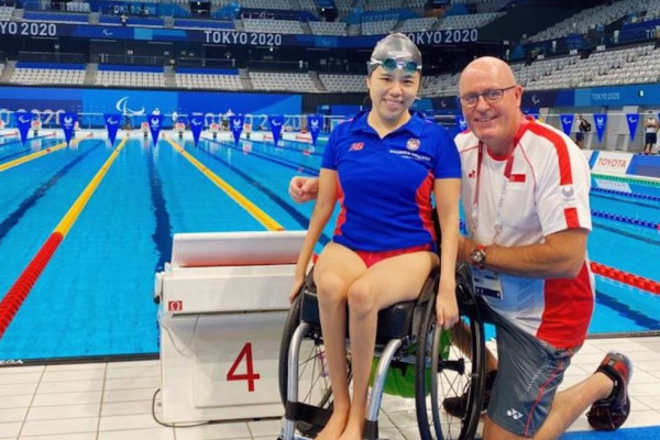 Head of Swimming Mick Massey and Singapore's Paralympic Gold Medalist Yip Pin Xiu poolside at the Tokyo 2020 Paralympics
