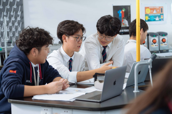 Students using laptops at school